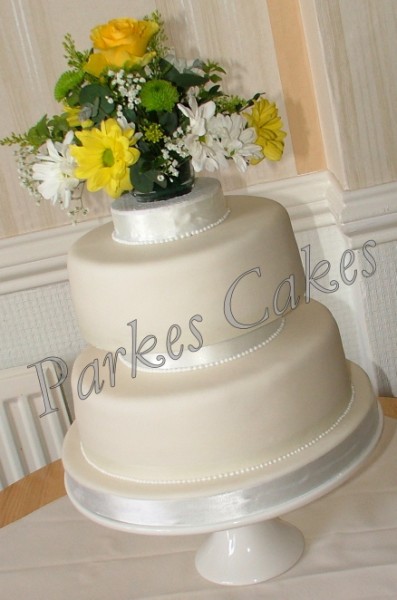 2 tier wedding cake with fresh summer flowers